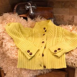 Heavy weight 100 0/0 wool sweater with leather look buttons. Size med